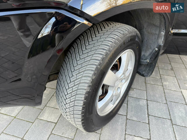 Черный Хендай Туксон, объемом двигателя 2 л и пробегом 249 тыс. км за 7450 $, фото 15 на Automoto.ua