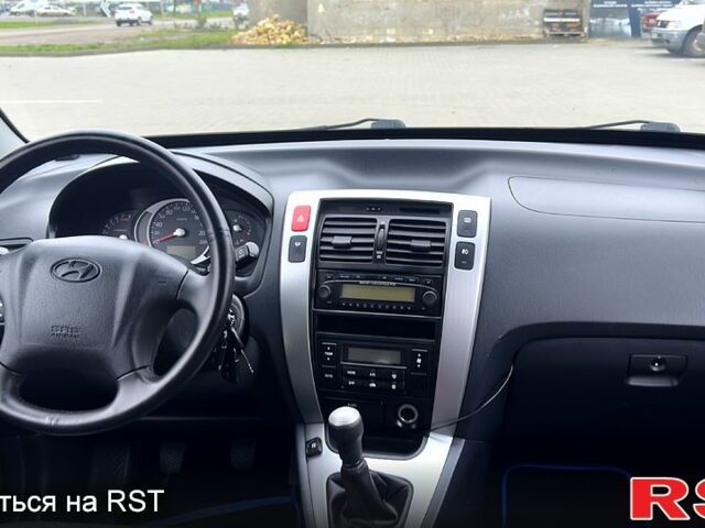 Черный Хендай Туксон, объемом двигателя 2 л и пробегом 200 тыс. км за 7800 $, фото 10 на Automoto.ua