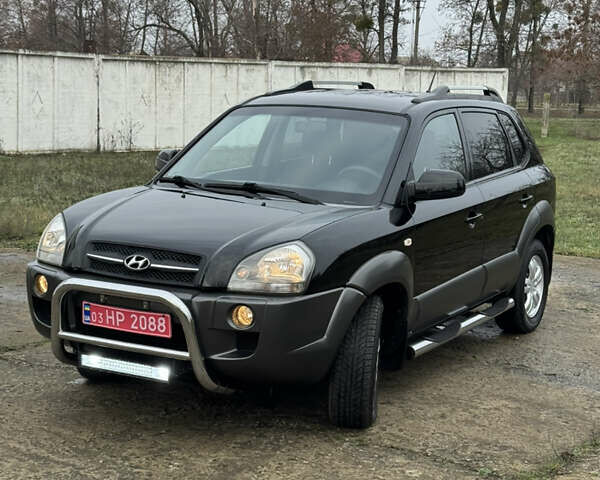 Черный Хендай Туксон, объемом двигателя 2 л и пробегом 201 тыс. км за 7750 $, фото 12 на Automoto.ua