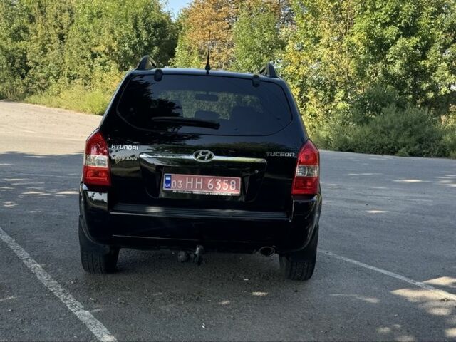 Черный Хендай Туксон, объемом двигателя 2 л и пробегом 266 тыс. км за 7700 $, фото 3 на Automoto.ua