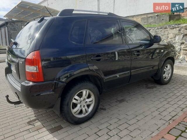 Черный Хендай Туксон, объемом двигателя 2 л и пробегом 280 тыс. км за 7400 $, фото 17 на Automoto.ua