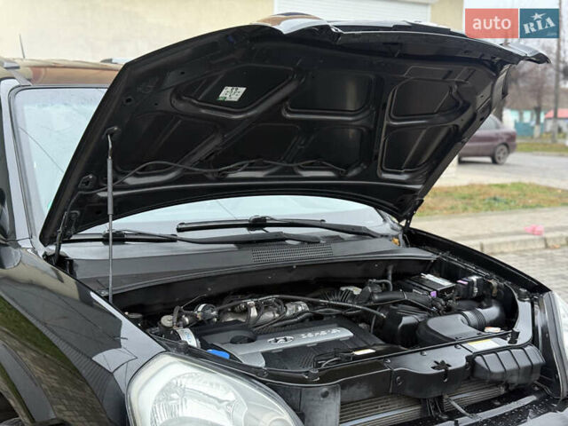 Черный Хендай Туксон, объемом двигателя 1.98 л и пробегом 231 тыс. км за 7750 $, фото 14 на Automoto.ua