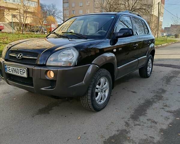 Черный Хендай Туксон, объемом двигателя 1.98 л и пробегом 256 тыс. км за 8000 $, фото 14 на Automoto.ua