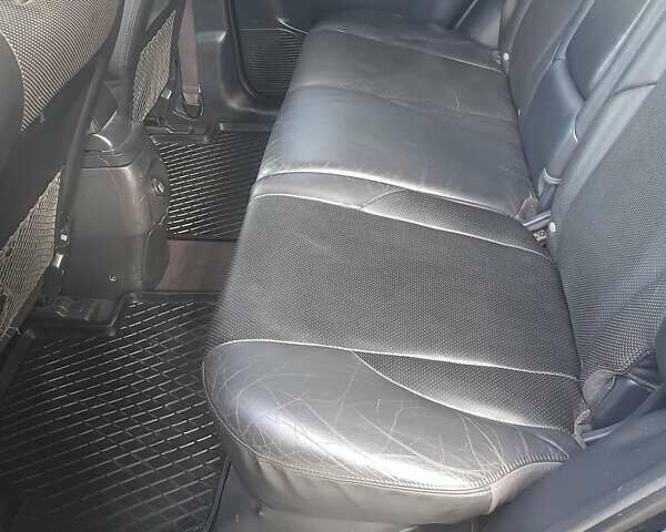 Черный Хендай Туксон, объемом двигателя 2 л и пробегом 280 тыс. км за 7400 $, фото 6 на Automoto.ua