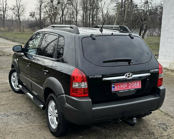 Черный Хендай Туксон, объемом двигателя 2 л и пробегом 201 тыс. км за 7750 $, фото 9 на Automoto.ua
