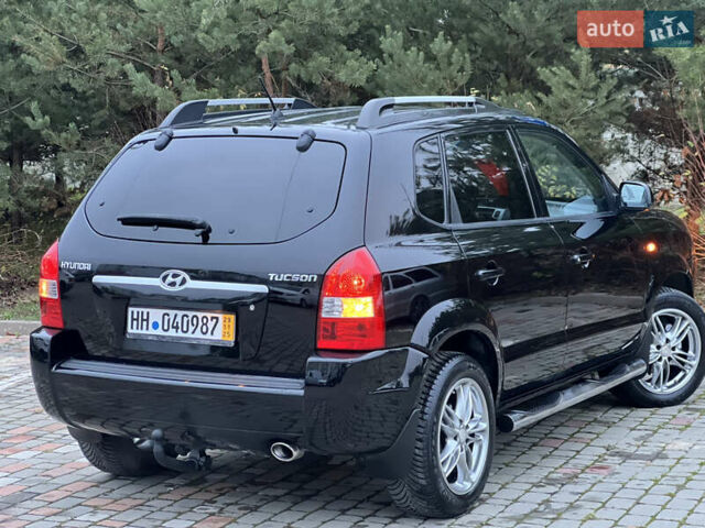 Чорний Хендай Туксон, об'ємом двигуна 1.98 л та пробігом 170 тис. км за 6999 $, фото 44 на Automoto.ua