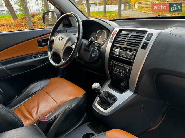 Черный Хендай Туксон, объемом двигателя 2 л и пробегом 210 тыс. км за 7990 $, фото 30 на Automoto.ua