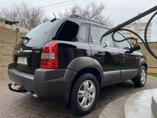 Черный Хендай Туксон, объемом двигателя 2 л и пробегом 186 тыс. км за 9400 $, фото 4 на Automoto.ua