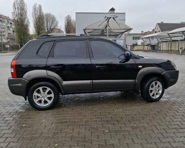 Чорний Хендай Туксон, об'ємом двигуна 2 л та пробігом 270 тис. км за 7500 $, фото 5 на Automoto.ua
