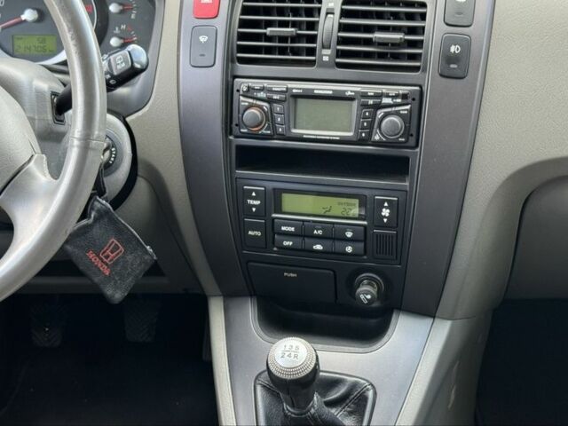 Черный Хендай Туксон, объемом двигателя 2 л и пробегом 266 тыс. км за 7700 $, фото 13 на Automoto.ua