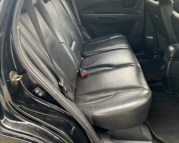 Черный Хендай Туксон, объемом двигателя 1.99 л и пробегом 290 тыс. км за 7700 $, фото 7 на Automoto.ua