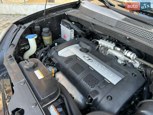 Черный Хендай Туксон, объемом двигателя 2 л и пробегом 249 тыс. км за 7450 $, фото 30 на Automoto.ua