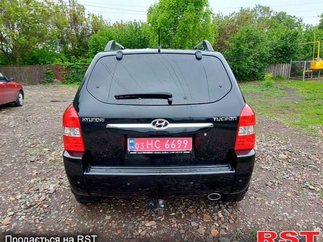 Черный Хендай Туксон, объемом двигателя 2 л и пробегом 130 тыс. км за 7200 $, фото 7 на Automoto.ua