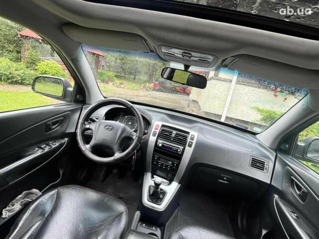 Черный Хендай Туксон, объемом двигателя 2.2 л и пробегом 230 тыс. км за 2300 $, фото 7 на Automoto.ua