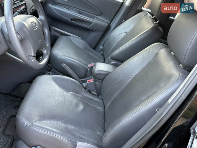 Чорний Хендай Туксон, об'ємом двигуна 1.98 л та пробігом 212 тис. км за 8200 $, фото 57 на Automoto.ua