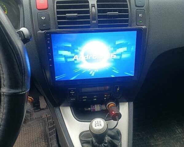 Черный Хендай Туксон, объемом двигателя 2 л и пробегом 220 тыс. км за 8300 $, фото 6 на Automoto.ua