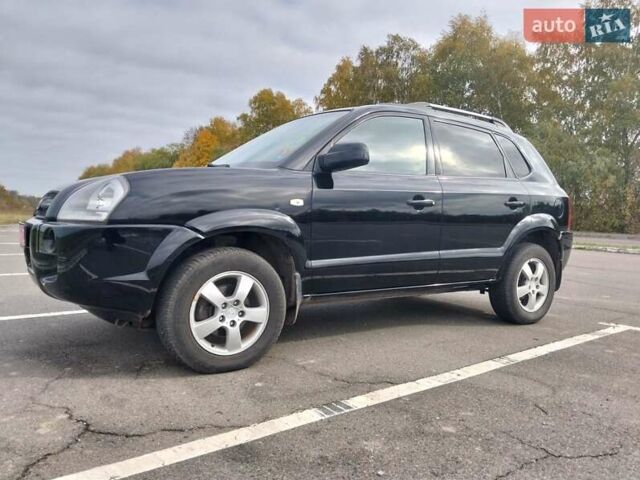 Черный Хендай Туксон, объемом двигателя 2 л и пробегом 127 тыс. км за 7590 $, фото 6 на Automoto.ua
