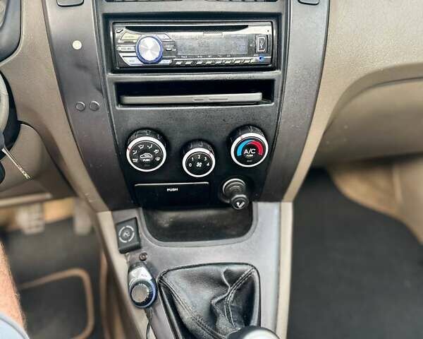 Черный Хендай Туксон, объемом двигателя 1.98 л и пробегом 277 тыс. км за 5350 $, фото 3 на Automoto.ua