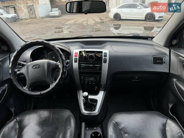 Черный Хендай Туксон, объемом двигателя 1.98 л и пробегом 198 тыс. км за 7500 $, фото 17 на Automoto.ua