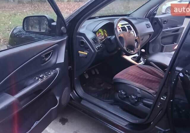 Черный Хендай Туксон, объемом двигателя 1.98 л и пробегом 320 тыс. км за 6300 $, фото 22 на Automoto.ua