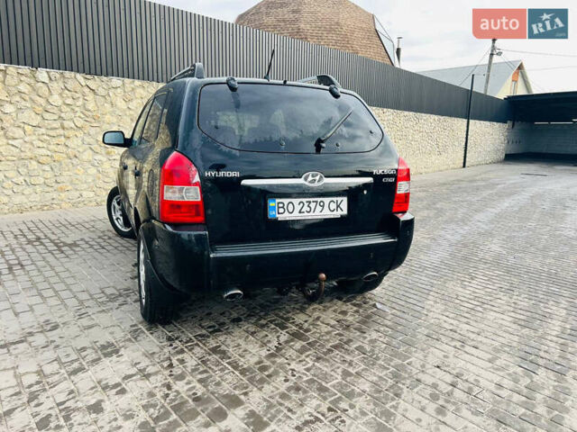 Черный Хендай Туксон, объемом двигателя 1.99 л и пробегом 310 тыс. км за 6600 $, фото 5 на Automoto.ua