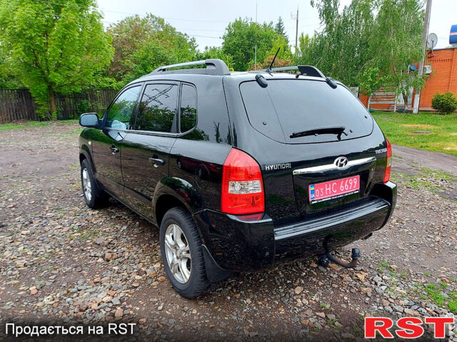 Черный Хендай Туксон, объемом двигателя 2 л и пробегом 130 тыс. км за 7200 $, фото 6 на Automoto.ua