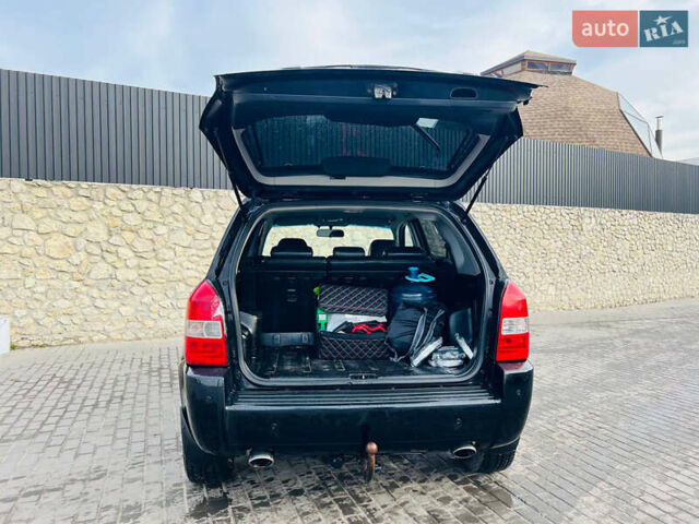 Черный Хендай Туксон, объемом двигателя 1.99 л и пробегом 310 тыс. км за 6600 $, фото 6 на Automoto.ua