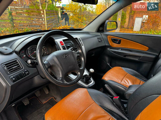 Черный Хендай Туксон, объемом двигателя 2 л и пробегом 210 тыс. км за 7990 $, фото 13 на Automoto.ua
