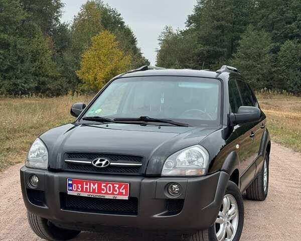 Черный Хендай Туксон, объемом двигателя 2 л и пробегом 209 тыс. км за 7600 $, фото 1 на Automoto.ua