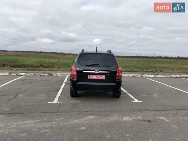 Черный Хендай Туксон, объемом двигателя 2 л и пробегом 127 тыс. км за 7590 $, фото 27 на Automoto.ua