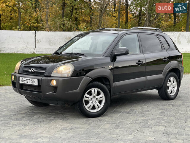 Черный Хендай Туксон, объемом двигателя 2 л и пробегом 216 тыс. км за 7700 $, фото 1 на Automoto.ua