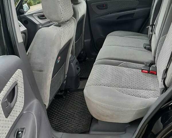 Черный Хендай Туксон, объемом двигателя 2 л и пробегом 216 тыс. км за 7600 $, фото 22 на Automoto.ua