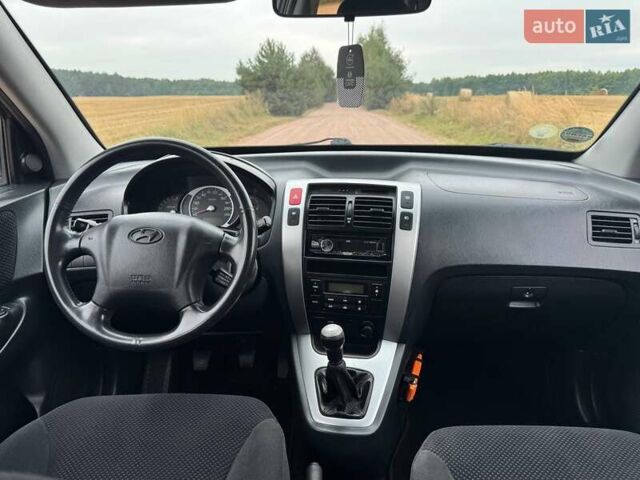 Черный Хендай Туксон, объемом двигателя 2 л и пробегом 209 тыс. км за 7600 $, фото 23 на Automoto.ua