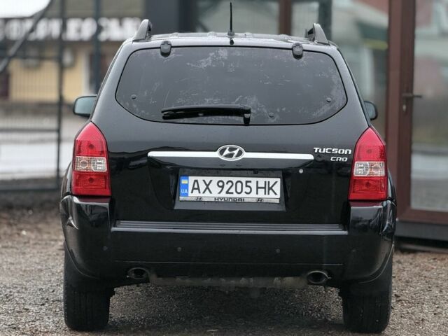 Черный Хендай Туксон, объемом двигателя 2 л и пробегом 263 тыс. км за 7950 $, фото 7 на Automoto.ua