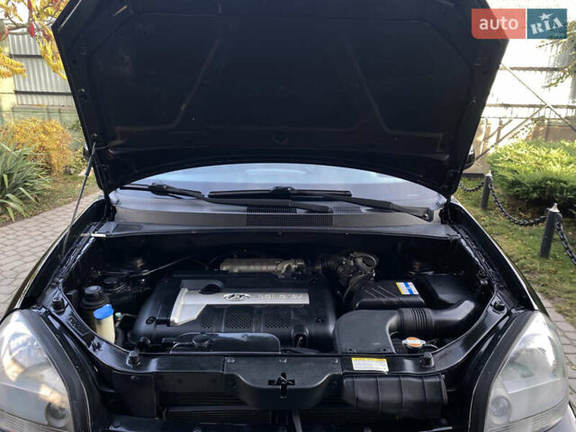 Чорний Хендай Туксон, об'ємом двигуна 1.98 л та пробігом 233 тис. км за 7650 $, фото 69 на Automoto.ua