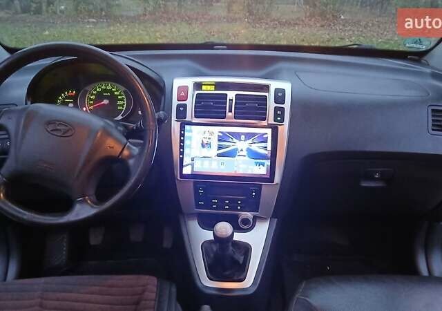 Чорний Хендай Туксон, об'ємом двигуна 1.98 л та пробігом 320 тис. км за 6500 $, фото 25 на Automoto.ua