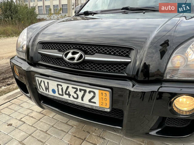 Чорний Хендай Туксон, об'ємом двигуна 2 л та пробігом 144 тис. км за 6599 $, фото 6 на Automoto.ua