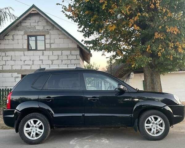 Черный Хендай Туксон, объемом двигателя 2 л и пробегом 290 тыс. км за 6800 $, фото 2 на Automoto.ua