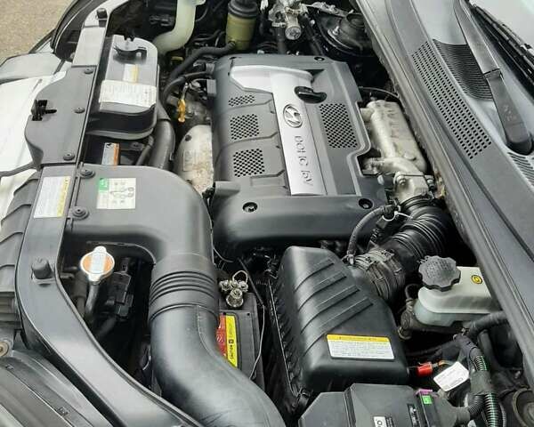 Черный Хендай Туксон, объемом двигателя 2 л и пробегом 216 тыс. км за 7600 $, фото 24 на Automoto.ua