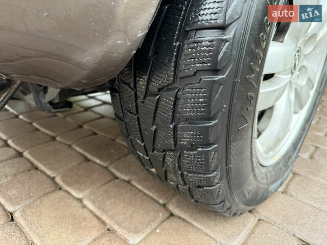 Черный Хендай Туксон, объемом двигателя 2 л и пробегом 256 тыс. км за 7450 $, фото 15 на Automoto.ua