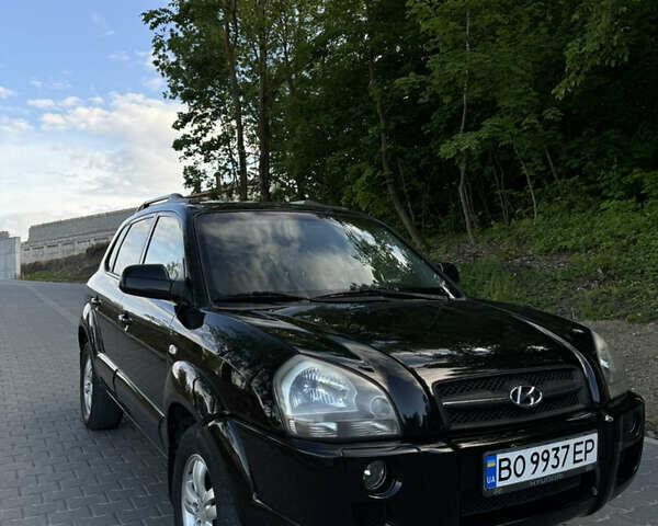 Черный Хендай Туксон, объемом двигателя 1.98 л и пробегом 290 тыс. км за 7300 $, фото 10 на Automoto.ua