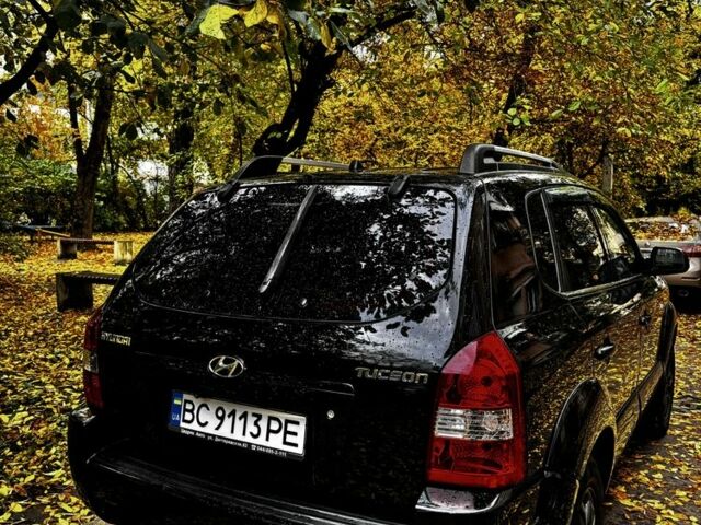 Черный Хендай Туксон, объемом двигателя 2 л и пробегом 240 тыс. км за 5600 $, фото 1 на Automoto.ua