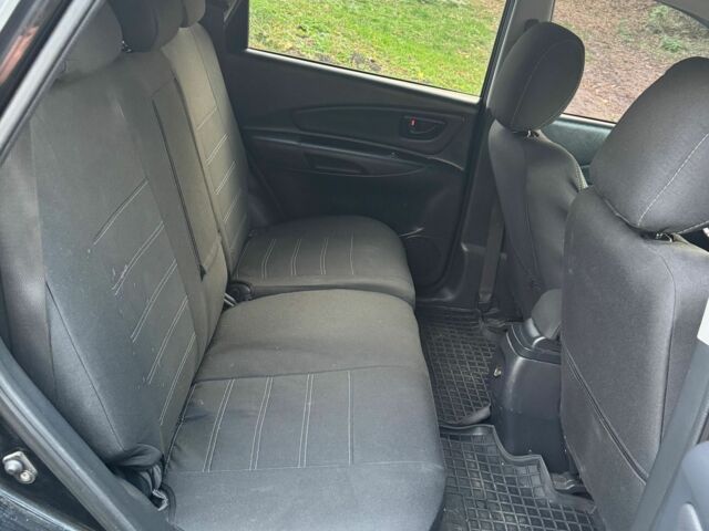 Черный Хендай Туксон, объемом двигателя 2 л и пробегом 210 тыс. км за 7200 $, фото 8 на Automoto.ua