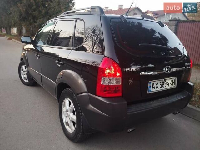 Чорний Хендай Туксон, об'ємом двигуна 1.99 л та пробігом 239 тис. км за 6990 $, фото 11 на Automoto.ua