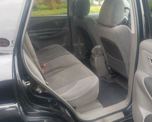 Черный Хендай Туксон, объемом двигателя 2 л и пробегом 231 тыс. км за 8000 $, фото 1 на Automoto.ua