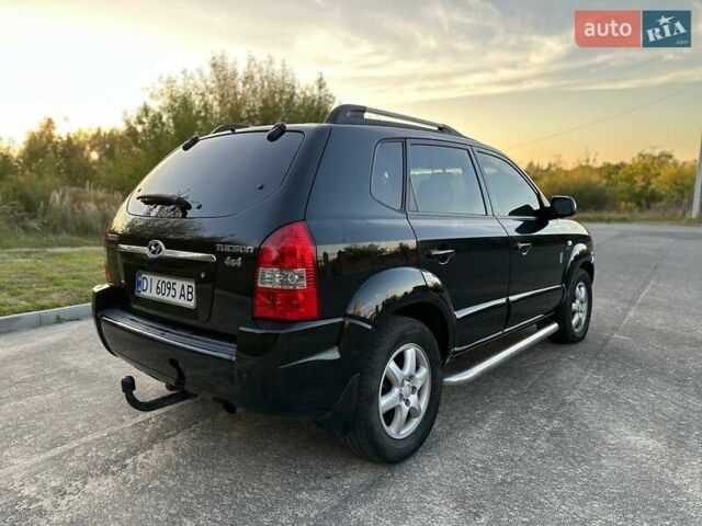 Черный Хендай Туксон, объемом двигателя 2 л и пробегом 235 тыс. км за 6700 $, фото 8 на Automoto.ua