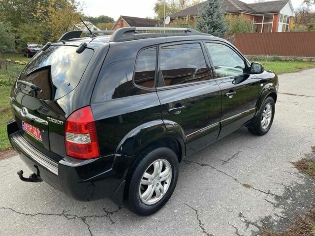 Черный Хендай Туксон, объемом двигателя 2 л и пробегом 163 тыс. км за 7700 $, фото 3 на Automoto.ua