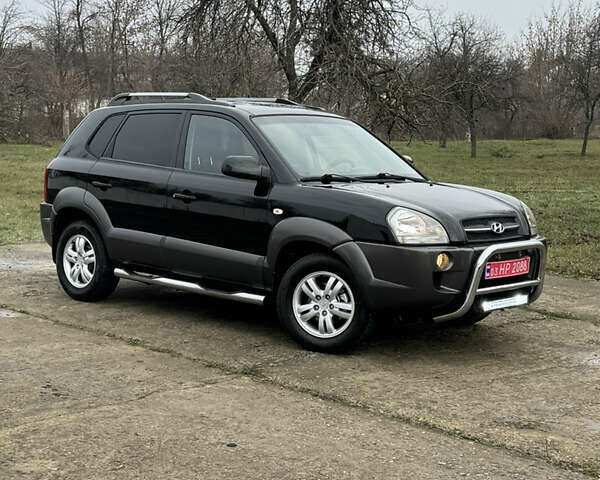 Черный Хендай Туксон, объемом двигателя 2 л и пробегом 201 тыс. км за 7750 $, фото 4 на Automoto.ua