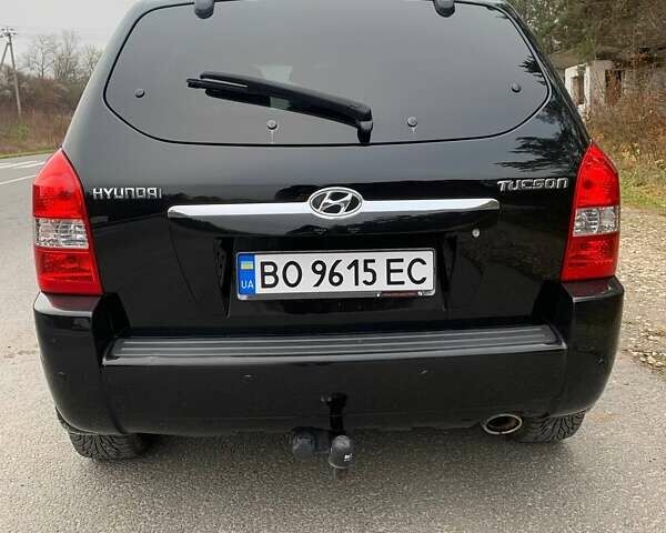 Черный Хендай Туксон, объемом двигателя 1.98 л и пробегом 196 тыс. км за 7700 $, фото 3 на Automoto.ua
