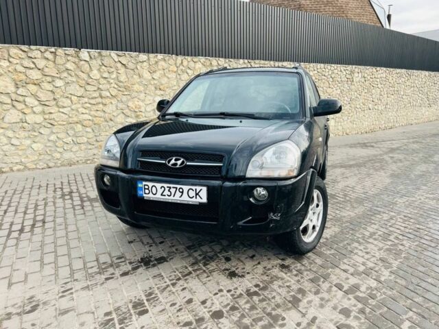 Черный Хендай Туксон, объемом двигателя 2 л и пробегом 310 тыс. км за 6600 $, фото 1 на Automoto.ua